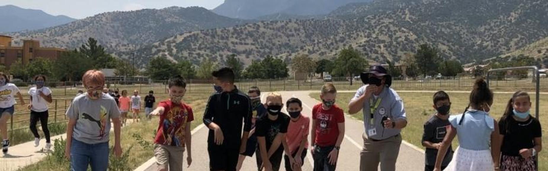 students line up to take a lap with Mr. Granillo