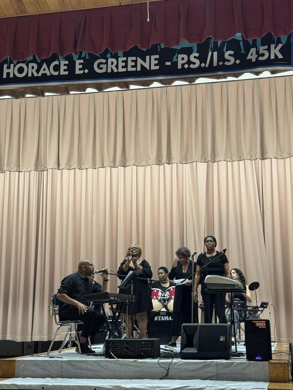The staff band performing