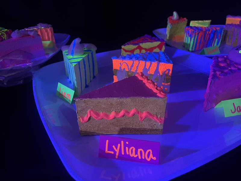 Student art project depicting cake slices.