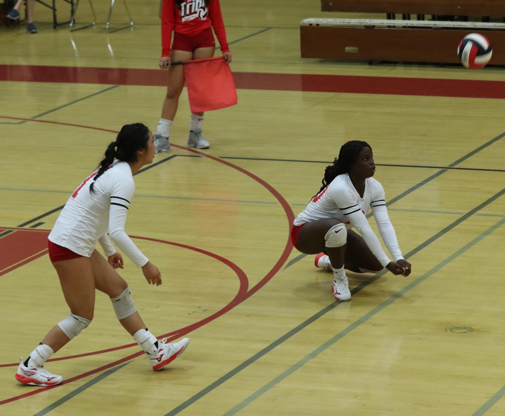 varsity volleyball players in action against golden valley