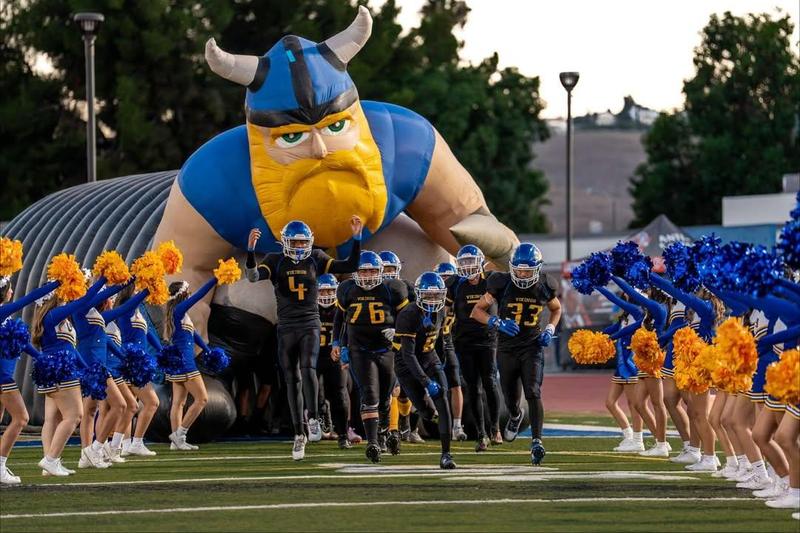 photo of football team with cheer