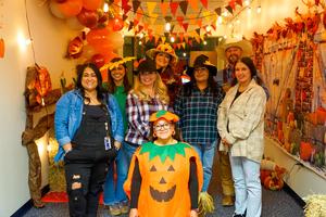 Human Resources staff pose in fall costumes