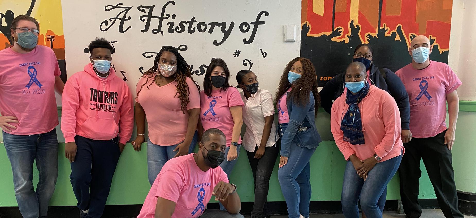 Staff members wear shirts to celebrate GO Pink! Day.