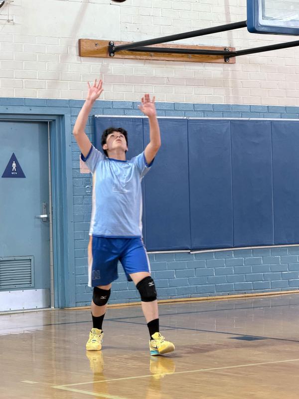 Student setting ball in game