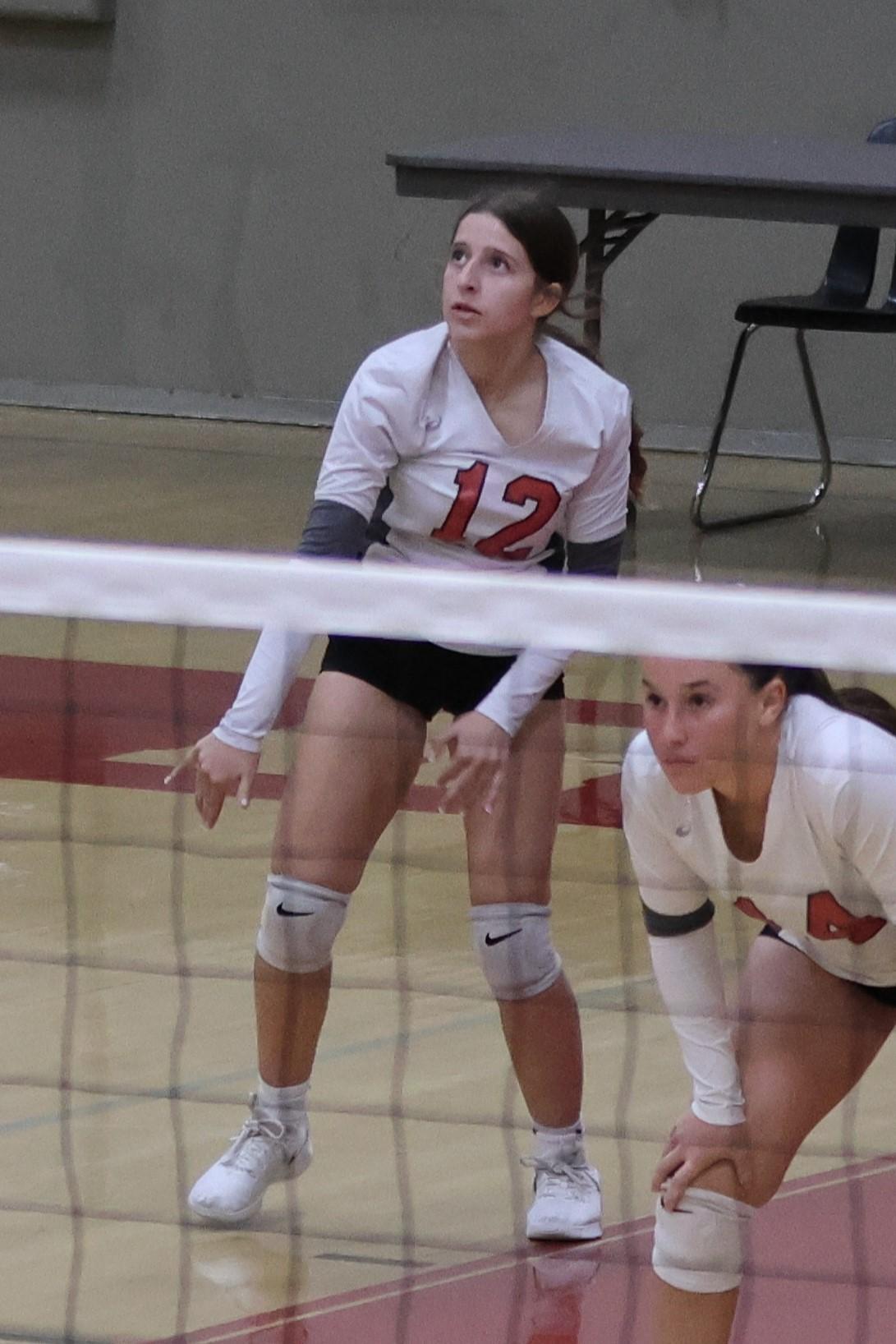 junior varsity girls playing volleyball 90