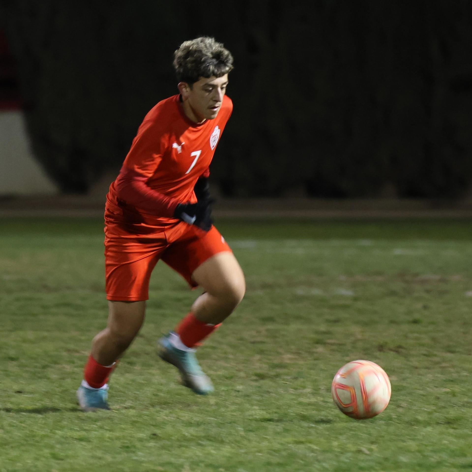 varisty boys soccer playing against yosemite