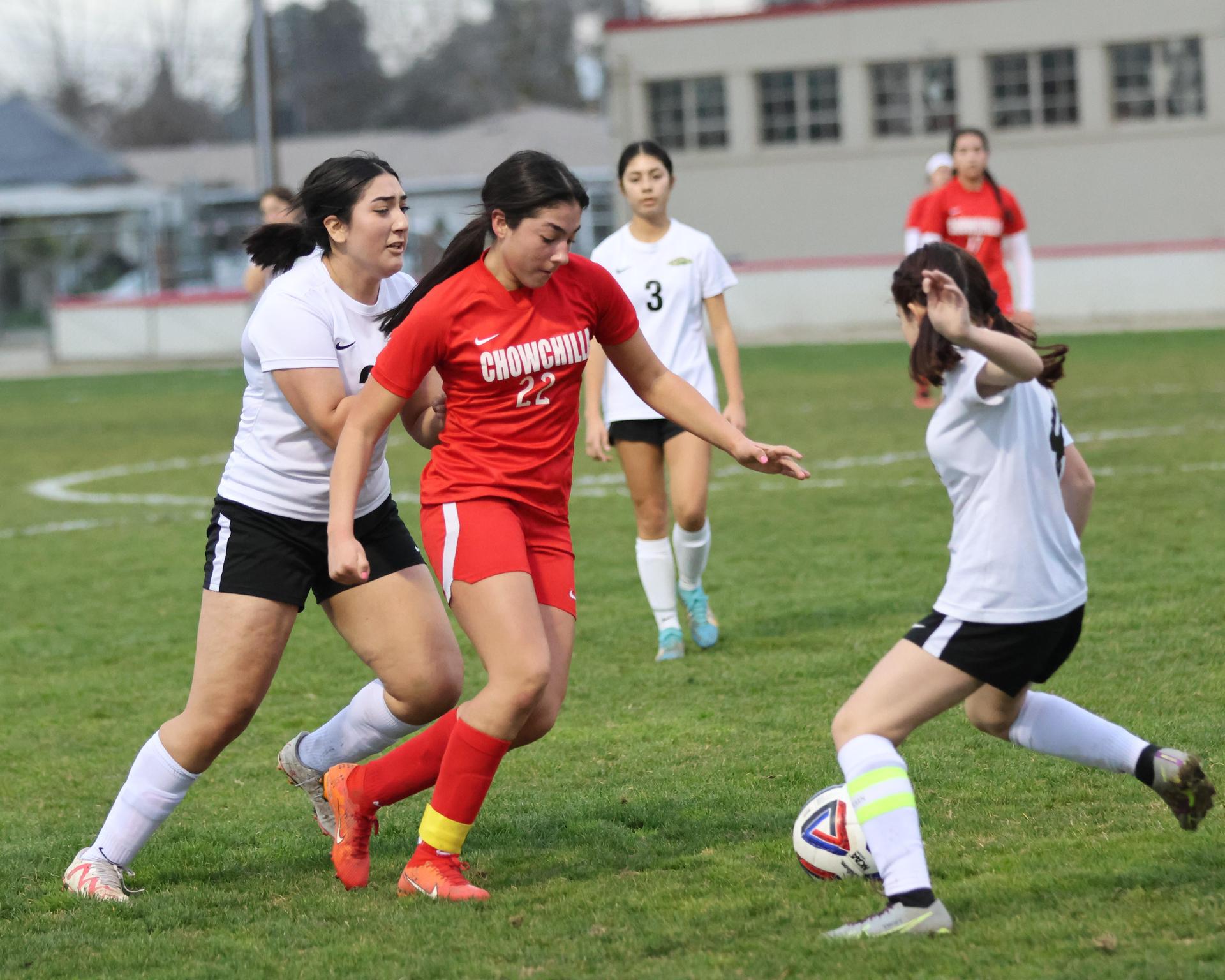 Junior varsity girls playing soccer against liberty