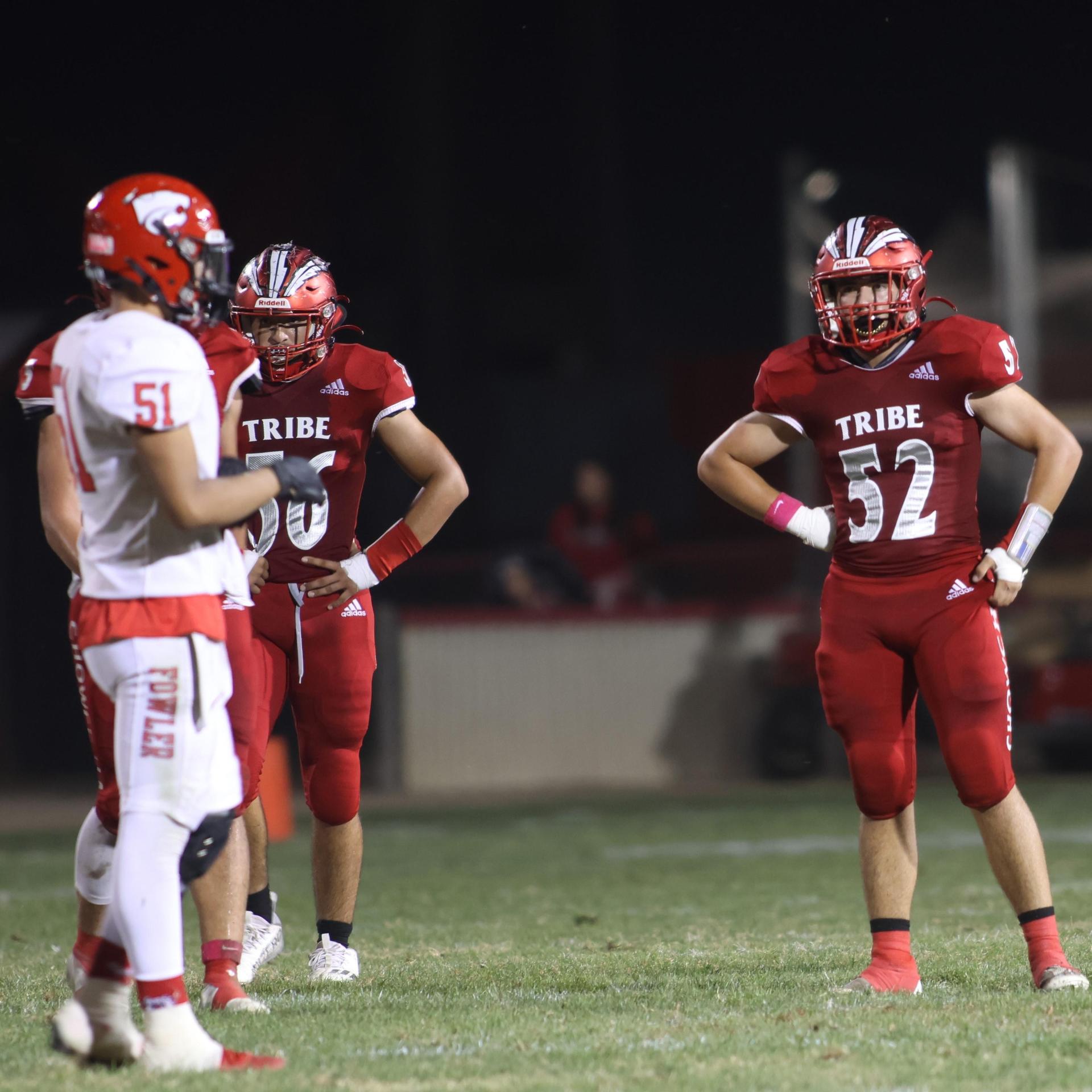 varsity boys playing football against Fowler