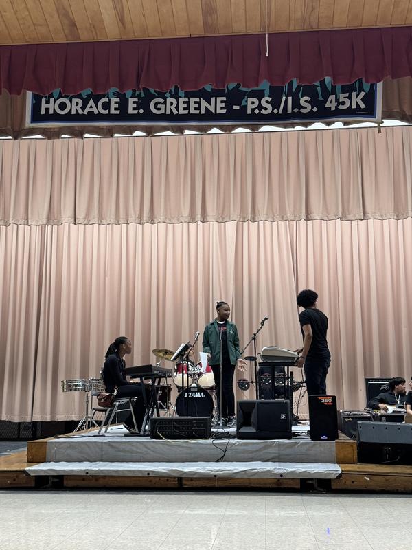 Our sixth grader performing a solo with the assistance of the band