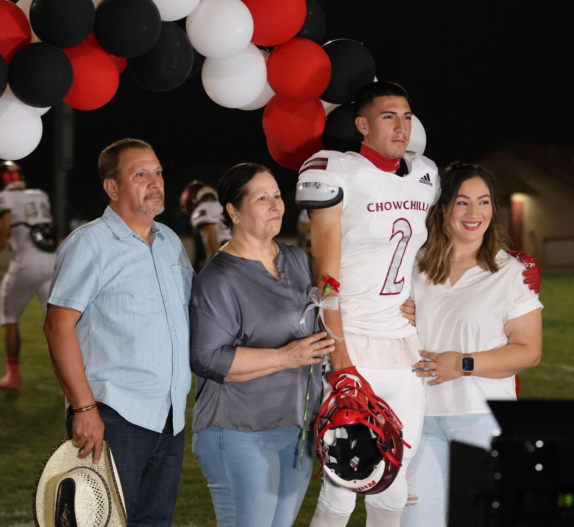 seniors and their escorts celebrating senior night