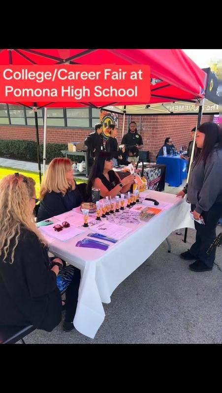 Pomona high School college and career fair,, students speak with colleges under tents in their school