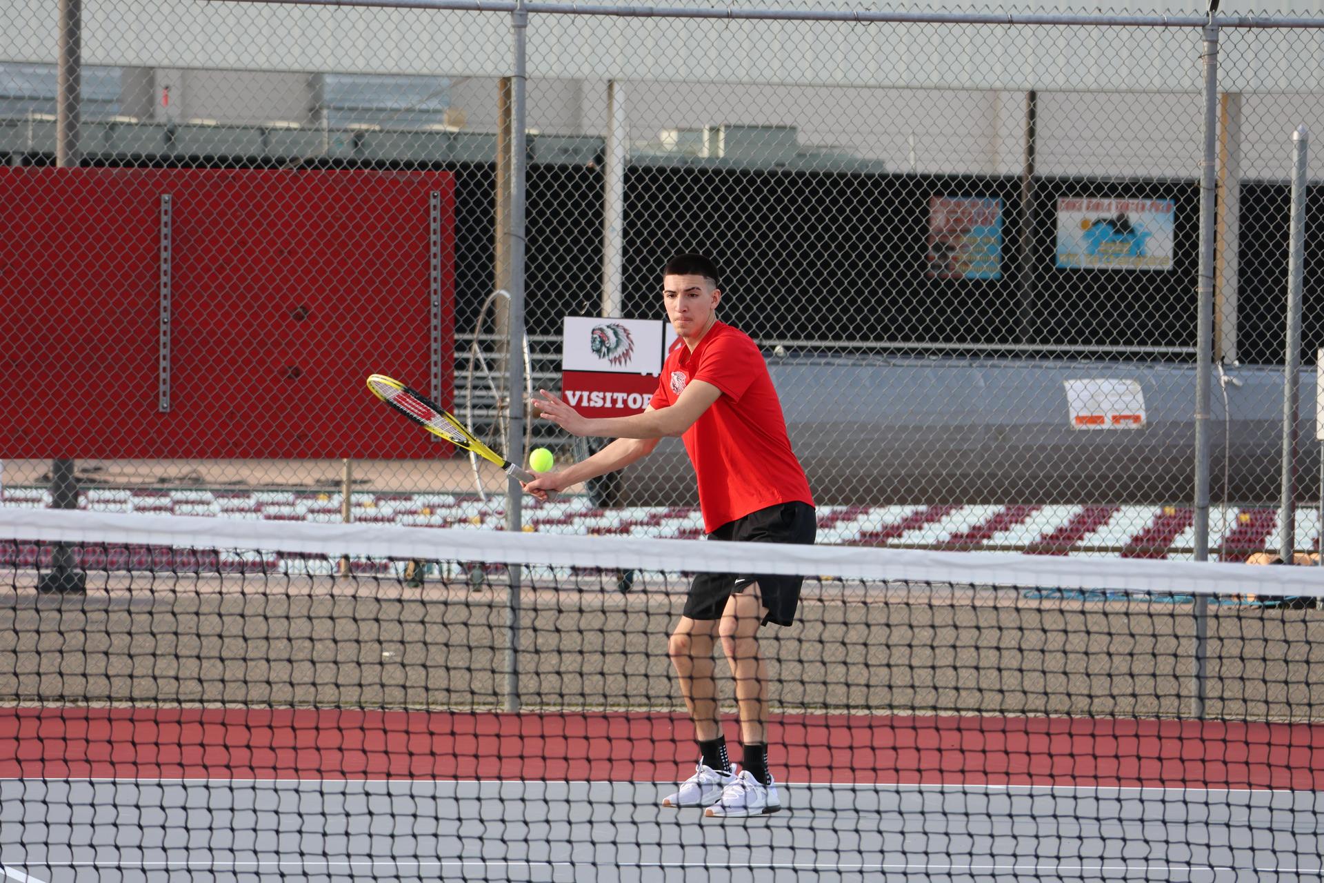 CUHS Boys playing tennis against coalinga