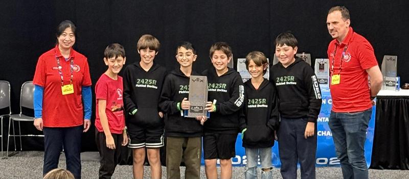 Robotics team accepting Judges Award at Worlds.