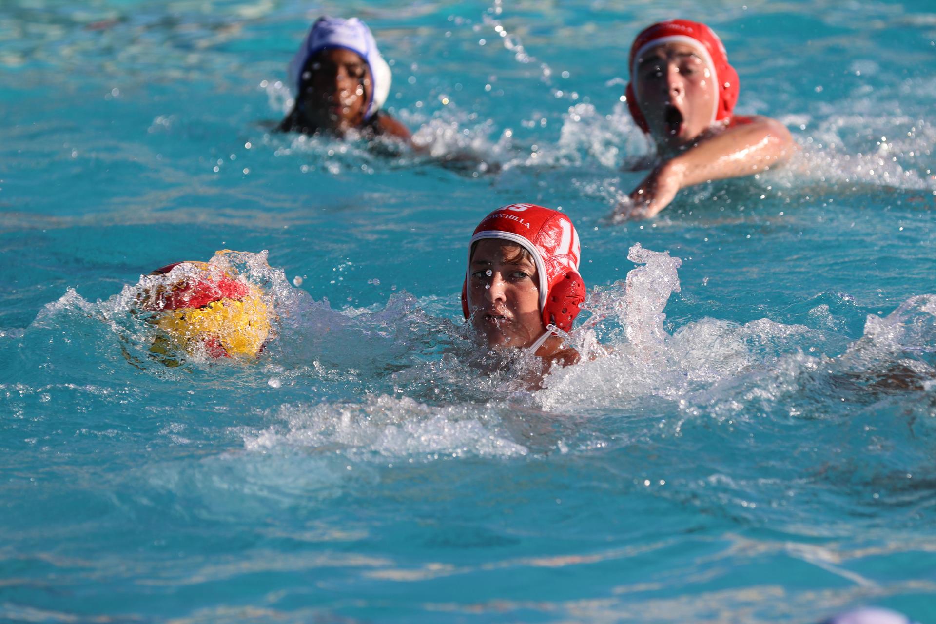 boys playing water polo against Madera