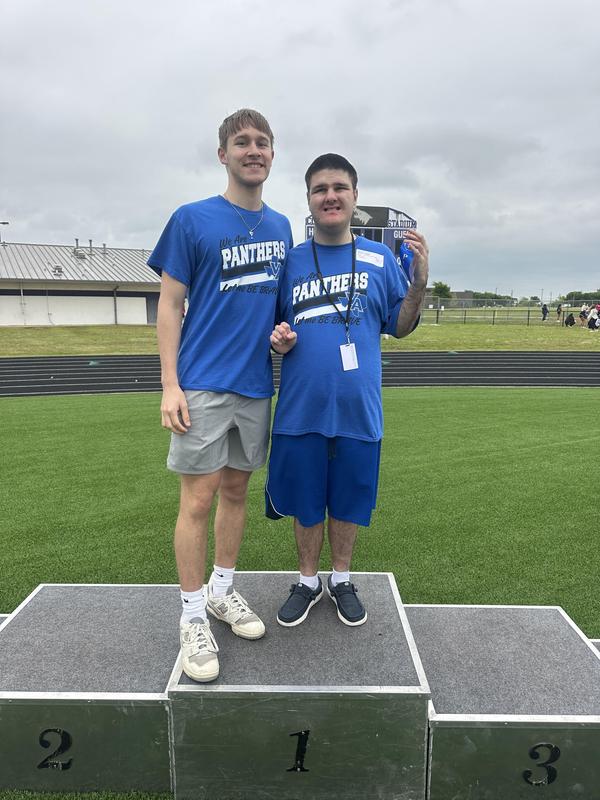 Unstoppable Athletes showing off their medals after their track meet in Anna