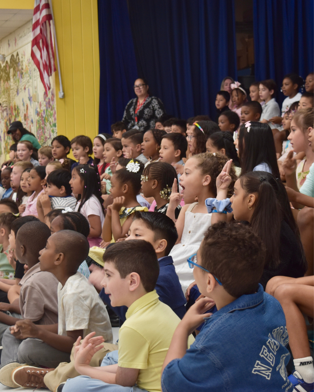 Students sing during LFJ moving up ceremony