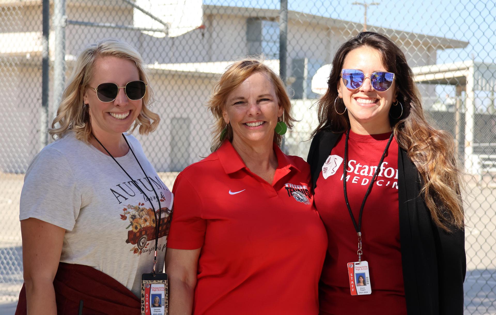 tennis players, family, and staff celebrating senior night