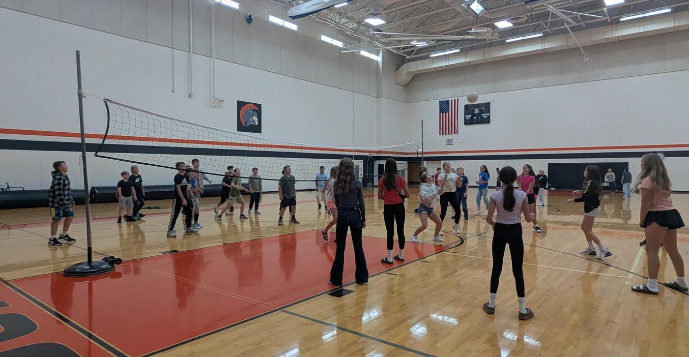 MS students enjoy a gam of volleyball during the activity night.