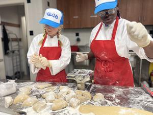 Students cooking pastries or bread