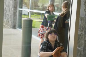 Students wash windows at the library.
