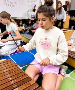 Student playing instrument