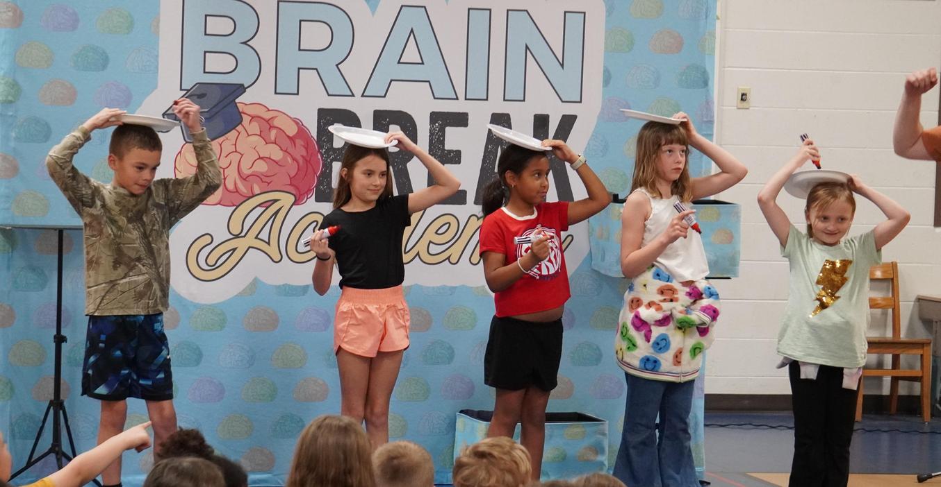 Students participate in a Brain Break Academy trick.