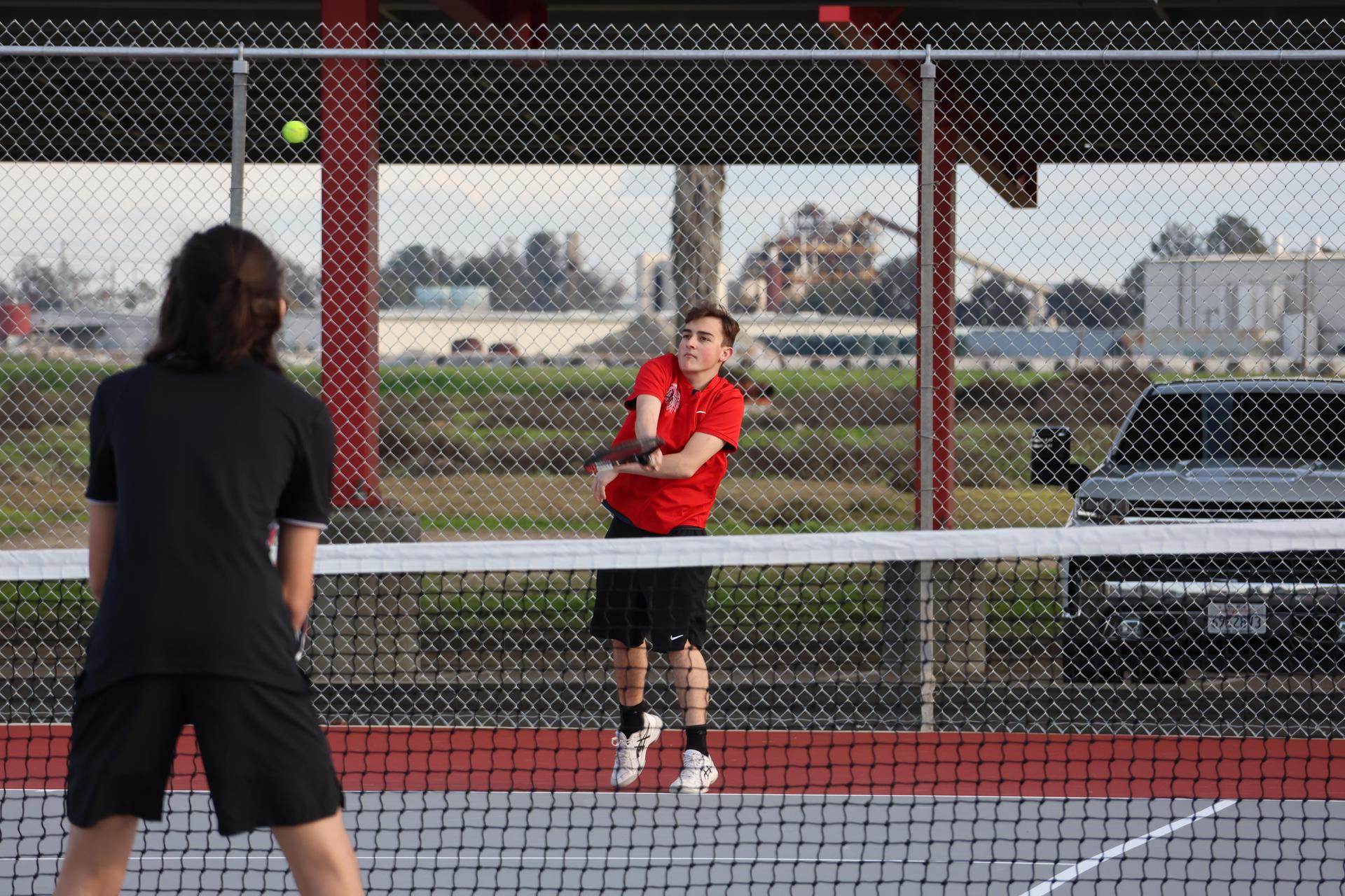 CUHS Boys playing tennis against coalinga