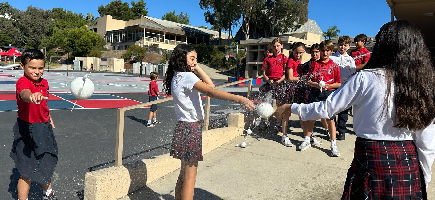 4th grade students learning about turbines in an experiment using water