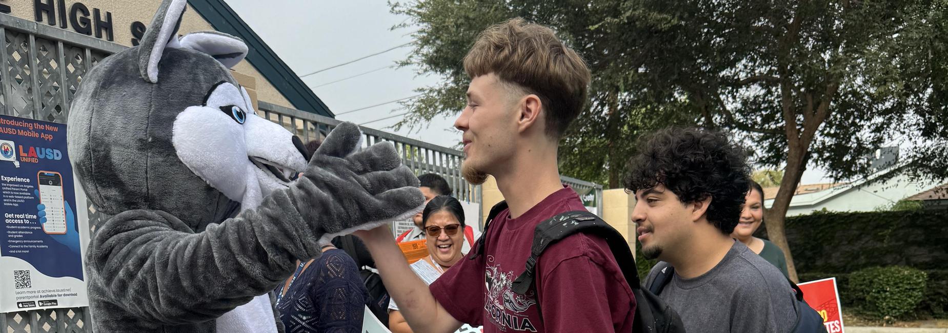 Cal Burke Husky greeting our students