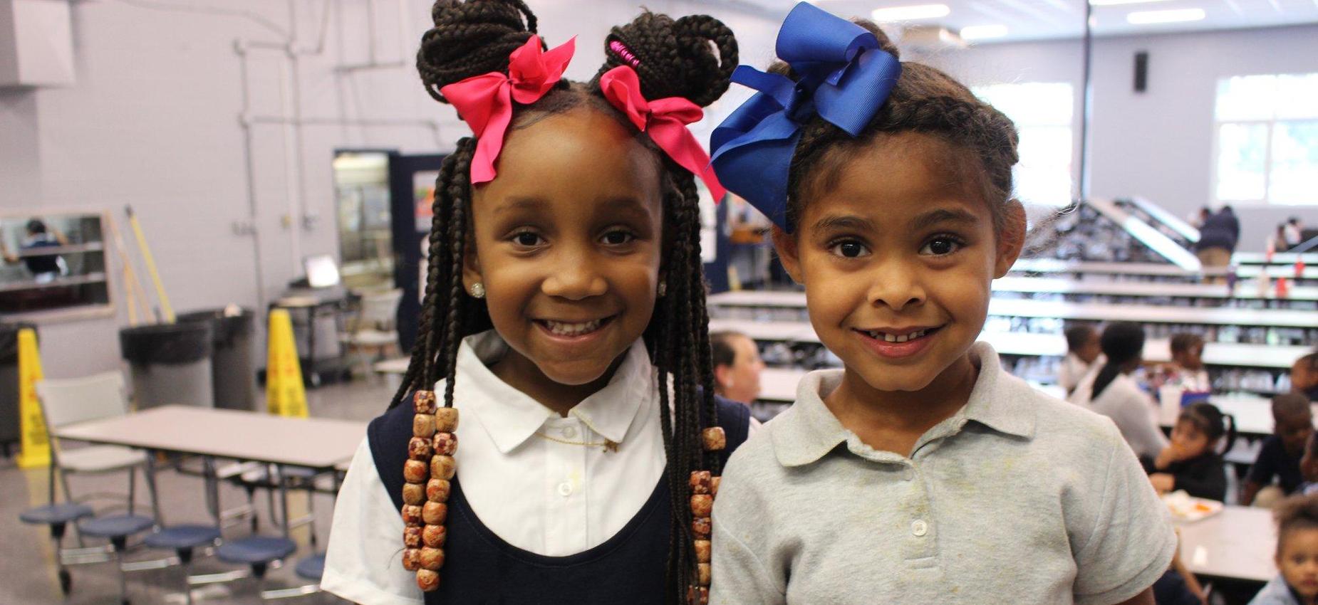 two girls smiling