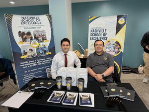 Nashville School of Excellence representatives at an informational booth during a community event