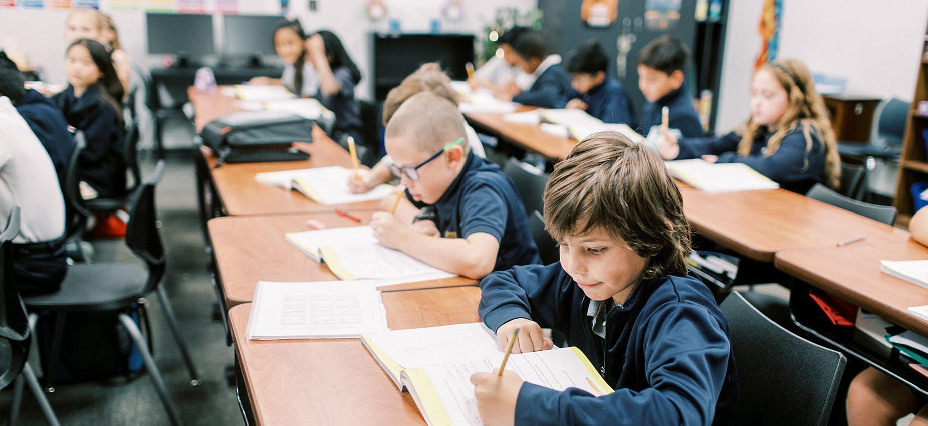 Students read and write at their desks
