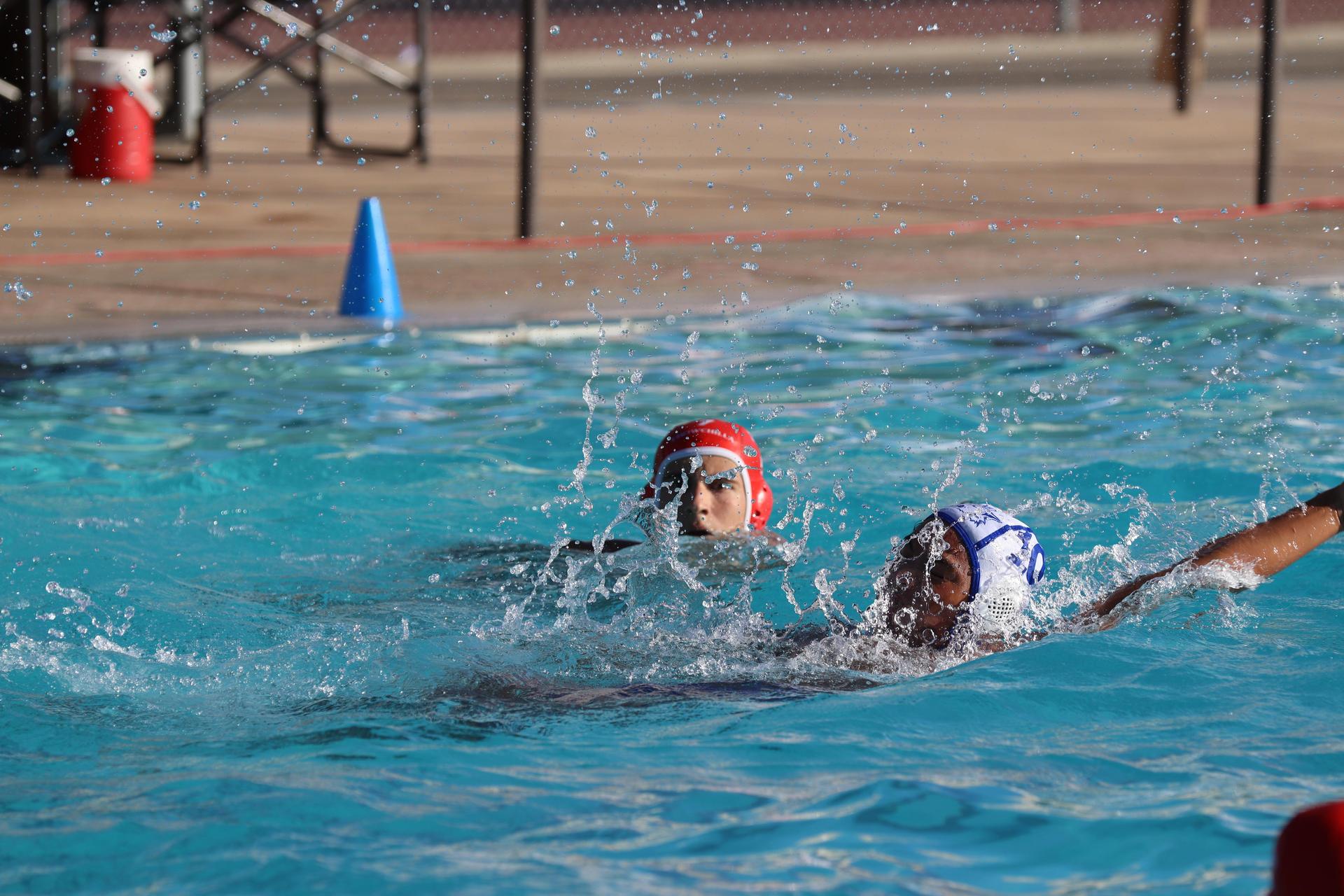 boys playing water polo against Madera