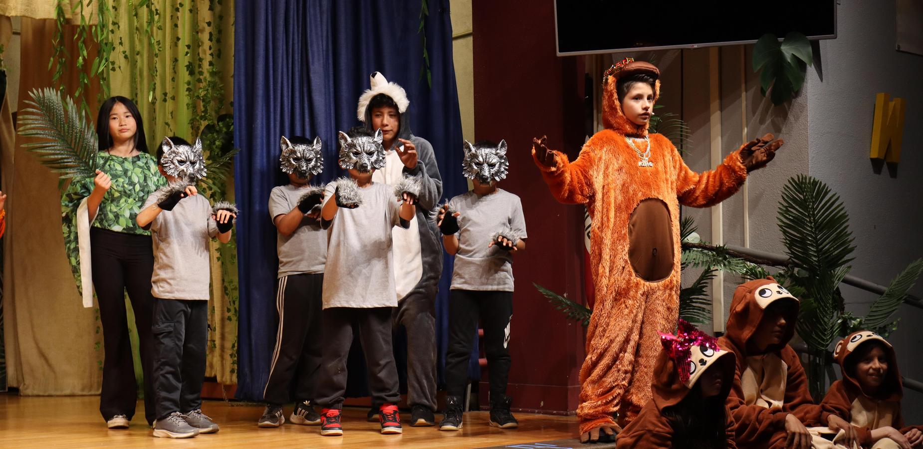 Students performing during their musical theater presentation.