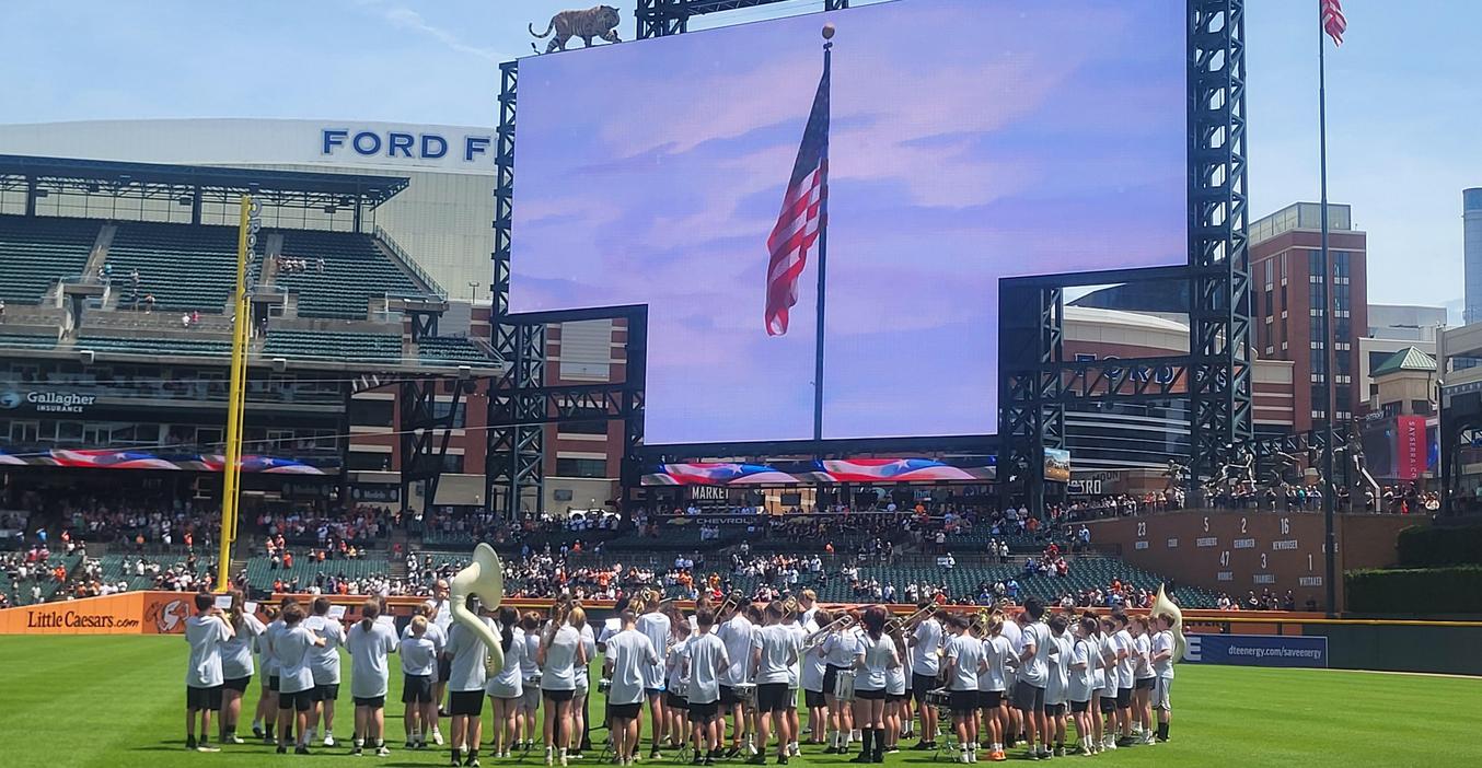 The middle school band performing the National Anthem at Comerica Park before a Tigers home game.