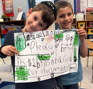 Kindergarteners show off their poster