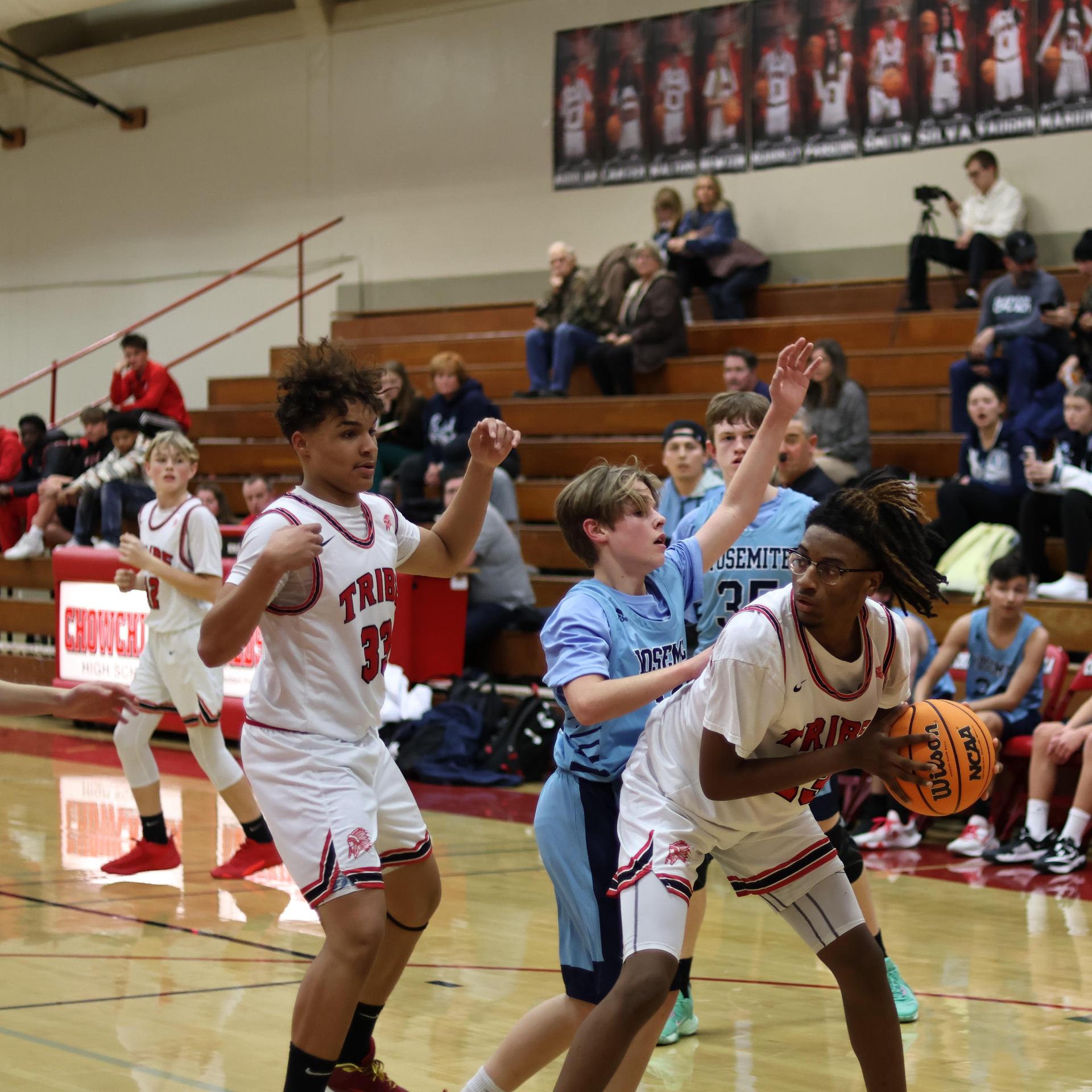 junior varsity boys playing basketball against yosemite