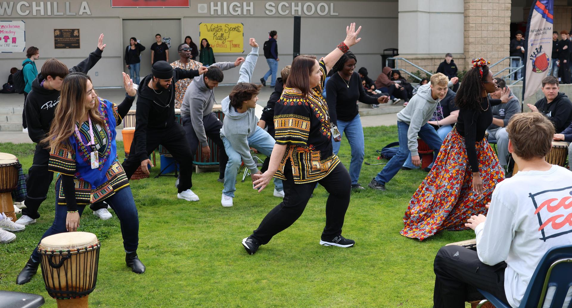 students and staff participating with the African Drum Interactive