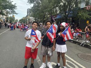 Students holding the Puerto Rican flags