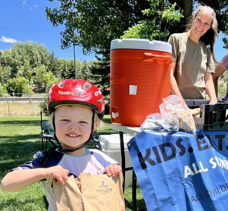 Summer Meals program boy with bag