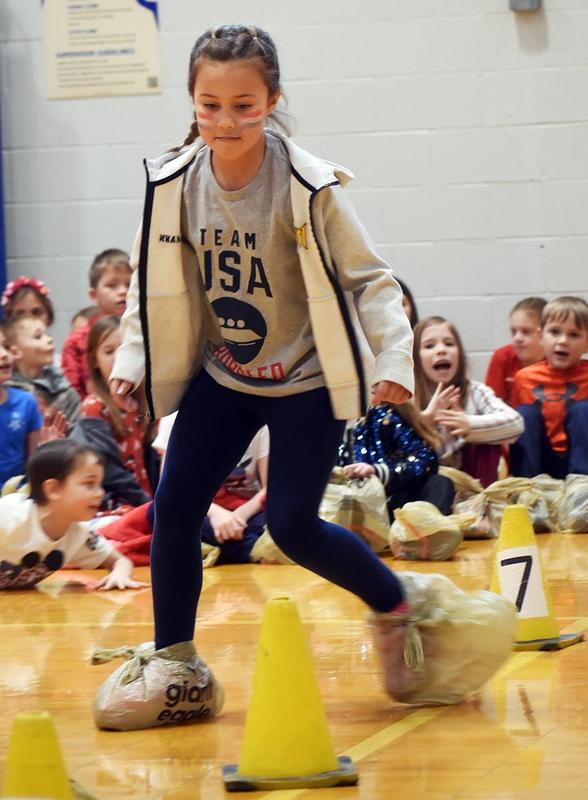 a girl running with plastic bags on her feet