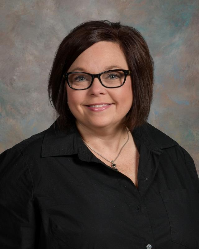 Mrs. Smith, the assistant principal, wearing a black blouse