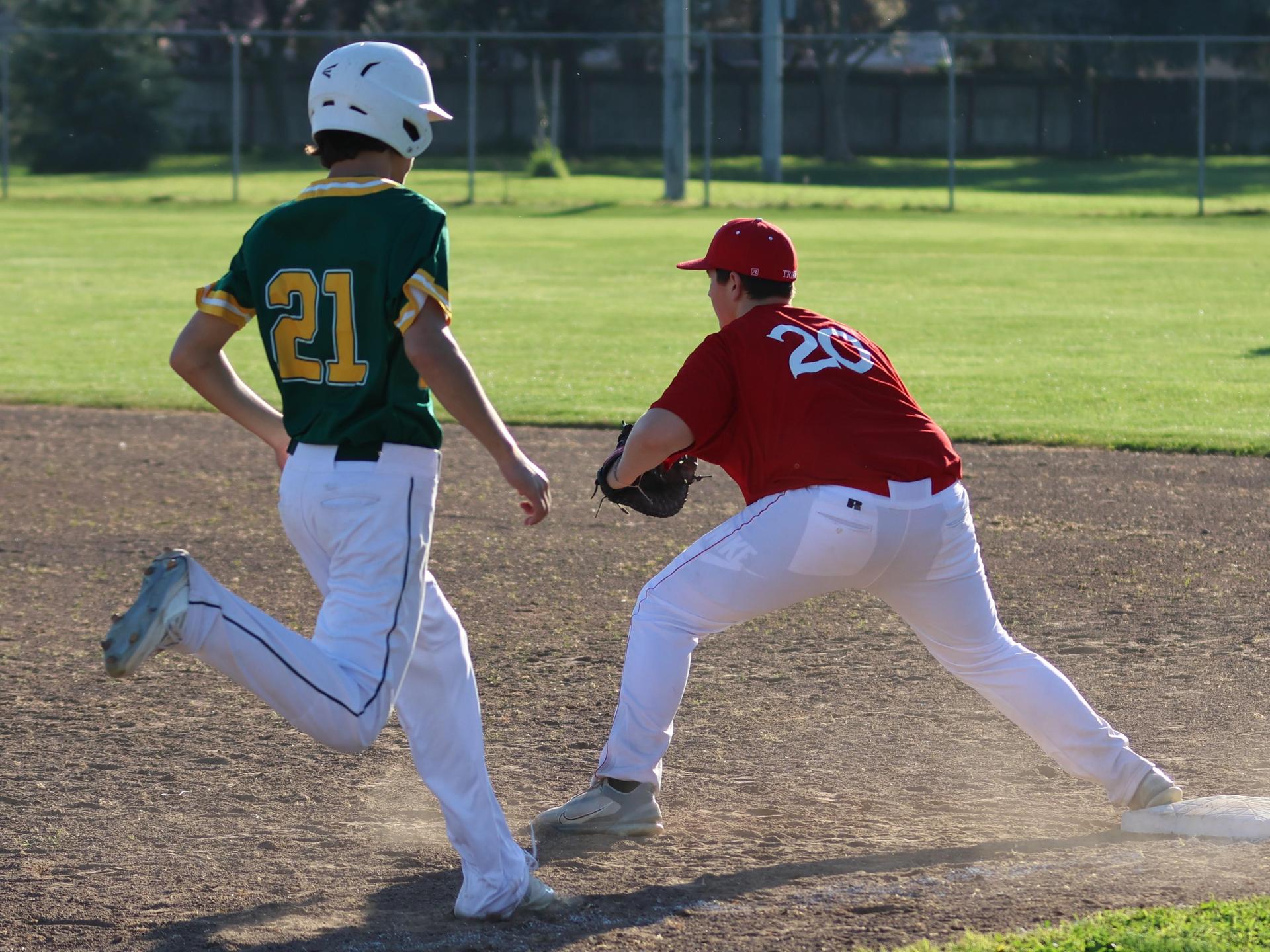 junior varsity baseball players in action