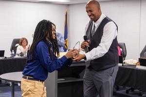 Xaiveyon presented with award by Mr. Grinage