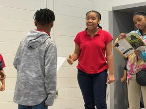 students acting on stage