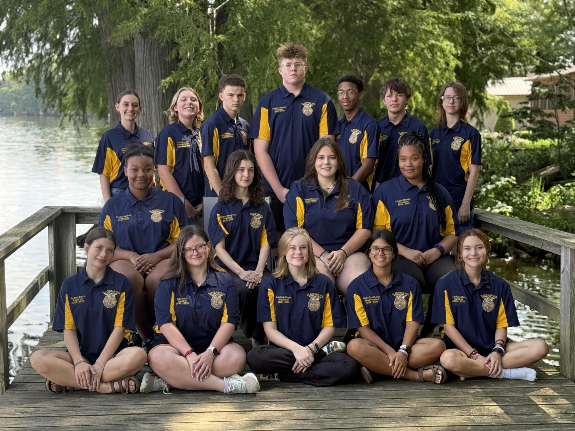A group of 16 Blackman FFA leaders pictured among a lake.
