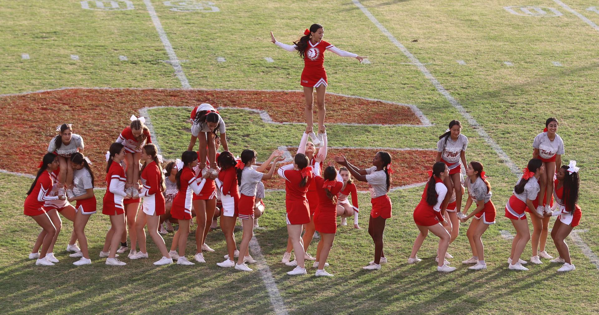 Combined cheer performing at halftime of the football game