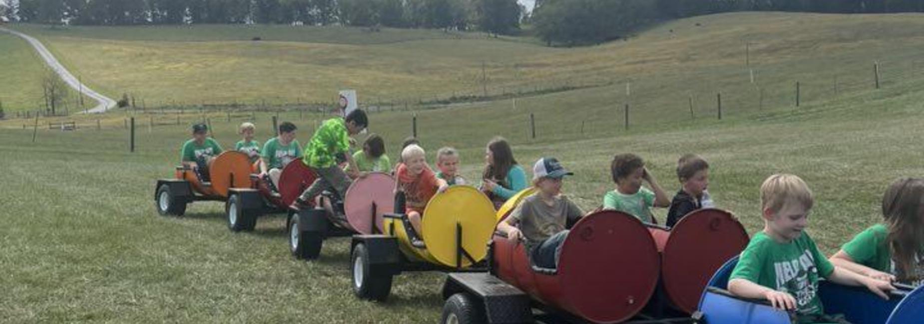 Students riding the train at Richdale Farm fieldtrip