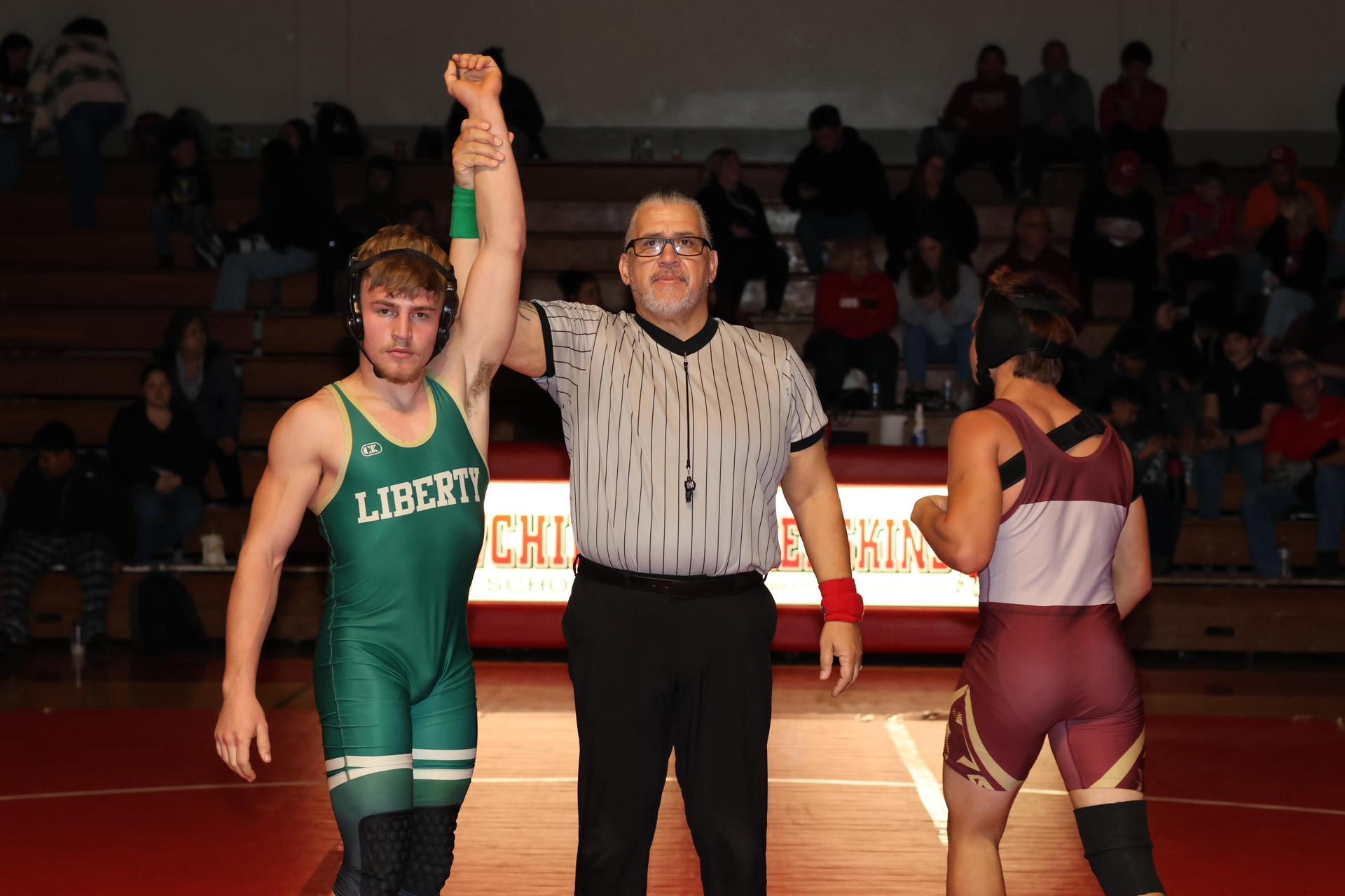 Wrestling winners with hands up 72