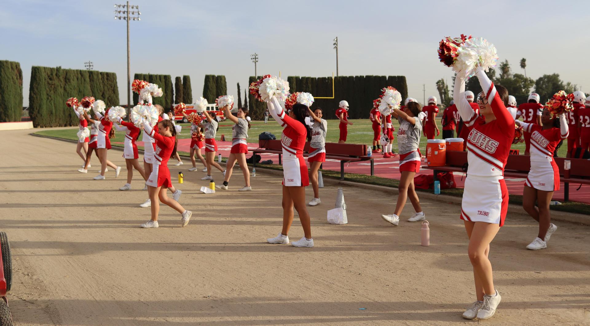junior varsity cheerleaders in action at the Riverdale game